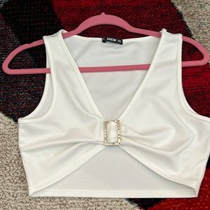 white crop top with rhinestone buckle